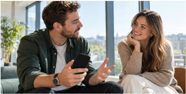 Two people are chatting casually in a bright, modern space